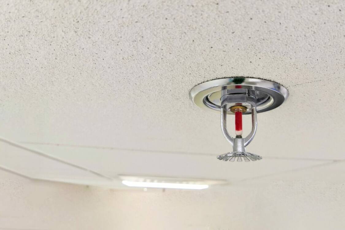 Fire Sprinkler System Close Up – Sprinkler Head on Ceiling fire sprinkler head close up
