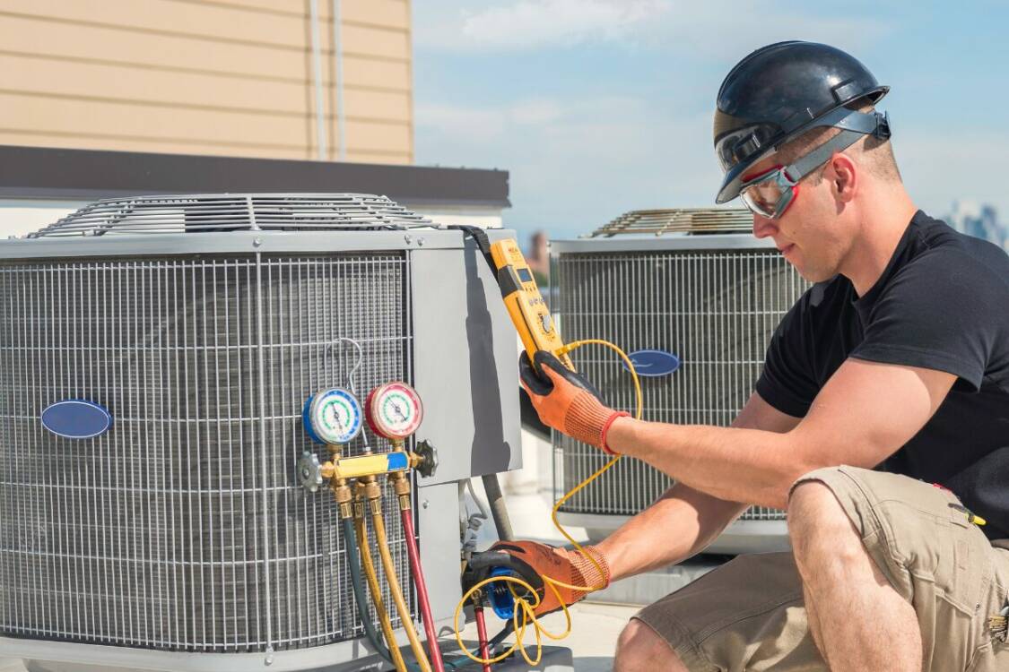Man Inspecting an HVAC Man Inspecting an HVAC - use InspectNTrack HVAC Inspection Software