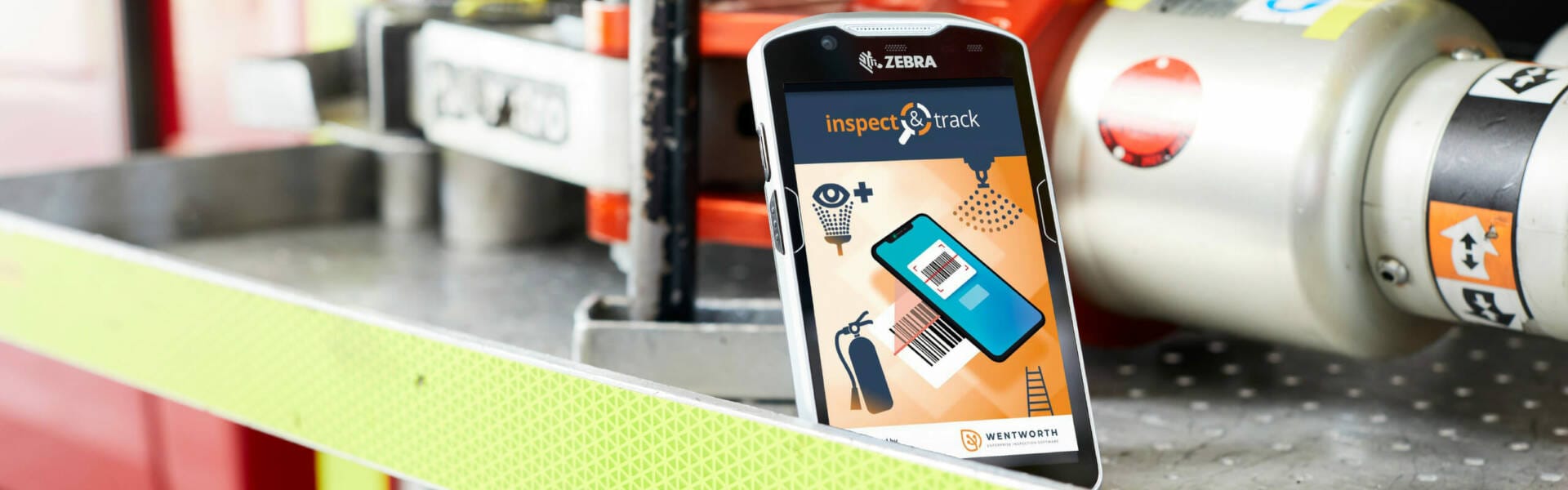 inspect fire door, inspectNtrack pulled up on a device that is resting against equipment
