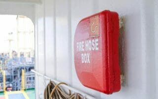 fire hose safety inspection - hose box hanging on the wall