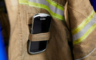 track safety inspections - Zebra device in fire fighter jacket pocket